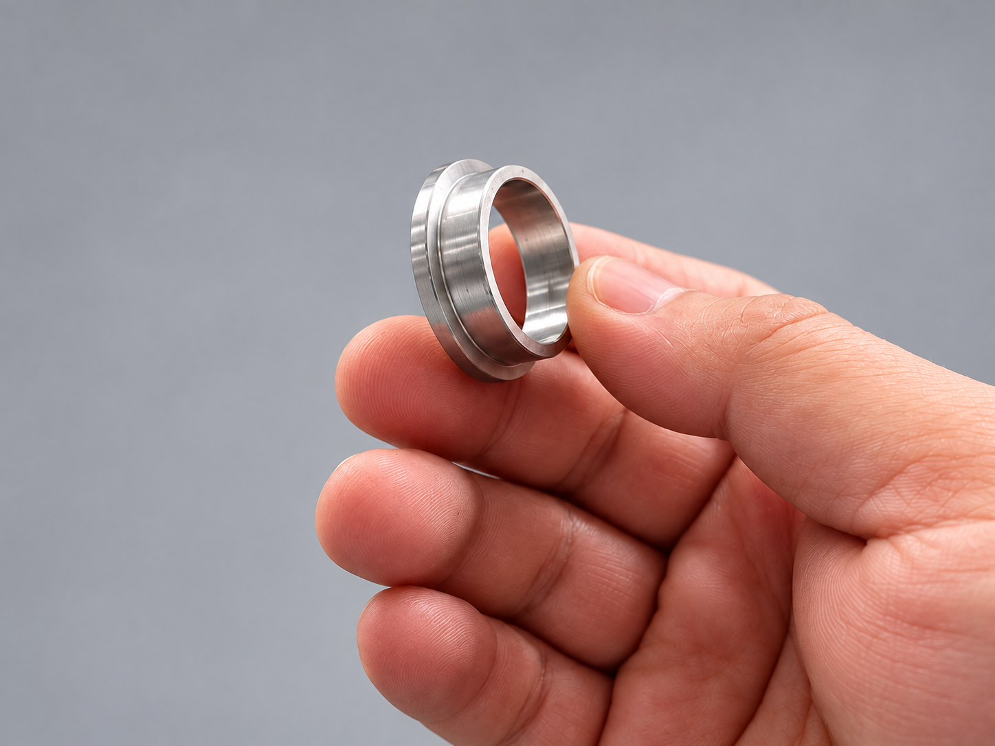 Automated Feeding and Turning for a Shock Absorber Locating Sleeve